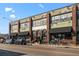Denver Central Market boasts a charming exterior with awnings, ample windows, and street-side parking at 3632 N Marion St, Denver, CO 80205