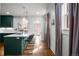 Gorgeous kitchen featuring a center island with pendant lighting and hardwood floors at 3632 N Marion St, Denver, CO 80205