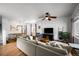 Spacious living room with hardwood floors, ceiling fan, and stairs to the second floor at 3632 N Marion St, Denver, CO 80205