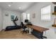 Bright home office featuring a treadmill, desk, and natural light at 3632 N Marion St, Denver, CO 80205