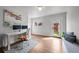 Bright home office with natural light, hardwood floors, modern desk setup, and door to the backyard at 3632 N Marion St, Denver, CO 80205