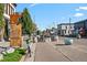 Urban street scene with art installations, greenery, and commercial buildings at 3632 N Marion St, Denver, CO 80205
