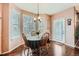 Bright breakfast nook with a large window and hardwood floors provides a cozy dining space at 3570 S Malaya St, Aurora, CO 80013