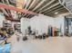 Unfinished basement area with open ceiling, concrete floor, and various storage items at 16658 Prospect Ln, Broomfield, CO 80023