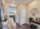 Inviting entryway with hardwood floors and views into the living area and kitchen at 16658 Prospect Ln, Broomfield, CO 80023