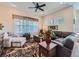 Cozy living room featuring neutral walls, lots of natural light, and dark hardwood floors at 16658 Prospect Ln, Broomfield, CO 80023