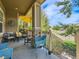 Inviting front porch features stone accents and comfortable seating with bright blue chairs at 16658 Prospect Ln, Broomfield, CO 80023