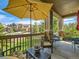 Cozy front porch area with a yellow umbrella and view of neighborhood street at 16658 Prospect Ln, Broomfield, CO 80023