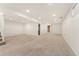 Spacious carpeted basement with recessed lighting at 2916 S Jasper St, Aurora, CO 80013