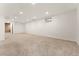 Finished basement area featuring neutral carpet and a small window at 2916 S Jasper St, Aurora, CO 80013