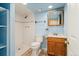 Bathroom featuring a walk-in shower, updated vanity, and neutral tones at 2916 S Jasper St, Aurora, CO 80013