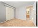 Bedroom with closet, light gray walls, and view to bathroom at 2916 S Jasper St, Aurora, CO 80013