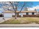 Charming single-story home featuring a brick facade, attached garage, and mature tree in the front yard at 2916 S Jasper St, Aurora, CO 80013