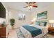 Comfortable bedroom featuring a plush bed, decorative pillows, and a coordinating area rug at 2916 S Jasper St, Aurora, CO 80013