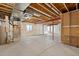 Unfinished basement space with concrete flooring and exposed beams, ready for customization at 4391 Mcmurdo Ct, Castle Rock, CO 80108