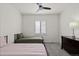 Inviting bedroom with twin beds, plush carpet, shutters, and dark dresser at 4391 Mcmurdo Ct, Castle Rock, CO 80108