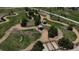 Aerial view of a dog park featuring meandering paths, shaded areas, and secure fencing for a pet-friendly community at 4391 Mcmurdo Ct, Castle Rock, CO 80108