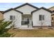 Inviting home with a charming front porch and manicured yard, perfect for relaxing and enjoying the outdoors at 4391 Mcmurdo Ct, Castle Rock, CO 80108