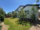 Beautiful home featuring a well-manicured lawn, stone accents, and lush landscaping for a picturesque setting at 4391 Mcmurdo Ct, Castle Rock, CO 80108