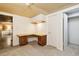 Basement office with built-in desk and ample closet space at 14022 W Alaska Dr, Lakewood, CO 80228