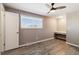 Bright bedroom with wood-look floors and built-in desk at 14022 W Alaska Dr, Lakewood, CO 80228