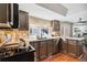 Modern kitchen with stainless steel appliances and ample counter space at 14022 W Alaska Dr, Lakewood, CO 80228