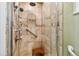 Walk-in shower with tiled walls and a built-in seat at 14022 W Alaska Dr, Lakewood, CO 80228