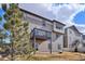 Exterior view of a backyard with a deck and a two-story home with nice siding in the background at 12663 Buffington Trl, Parker, CO 80134