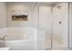 Elegant bathroom with soaking tub and separate glass-enclosed shower at 12663 Buffington Trl, Parker, CO 80134