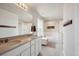 Bright bathroom featuring double sinks, soaking tub, and walk-in shower at 12663 Buffington Trl, Parker, CO 80134