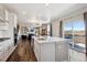 Modern kitchen with an island, stainless steel appliances, and an open floor plan at 12663 Buffington Trl, Parker, CO 80134