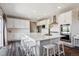 Well-lit kitchen with a large island, stainless steel appliances, and ample counter space at 12663 Buffington Trl, Parker, CO 80134