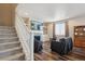 Cozy living room featuring a fireplace with stone surround and built-in shelving at 12663 Buffington Trl, Parker, CO 80134