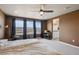 Primary bedroom featuring large windows with natural light and an ensuite bathroom at 12663 Buffington Trl, Parker, CO 80134