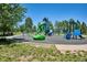 Community playground featuring modern equipment, perfect for Gathering fun at 12663 Buffington Trl, Parker, CO 80134