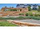 Landscaped entrance with a decorative stone sign for the Anthology community at 12663 Buffington Trl, Parker, CO 80134