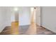 Open bedroom with wood flooring and an entrance to another room at 10150 E Virginia Ave # 7-204, Denver, CO 80247