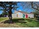 Charming community clubhouse with vending machines, surrounded by lush greenery and a beautiful mature tree at 10150 E Virginia Ave # 7-204, Denver, CO 80247