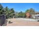 Outdoor community pool surrounded by trees and fencing, offering a refreshing space for relaxation and recreation at 10150 E Virginia Ave # 7-204, Denver, CO 80247