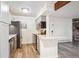 Stylish kitchen features stainless steel appliances, gray cabinets, and quartz countertops at 10150 E Virginia Ave # 7-204, Denver, CO 80247