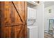 Efficient laundry area with a stackable washer and dryer unit at 10150 E Virginia Ave # 7-204, Denver, CO 80247