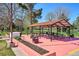 Inviting outdoor picnic area featuring covered seating and multiple tables, perfect for gatherings and relaxation at 10150 E Virginia Ave # 7-204, Denver, CO 80247