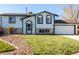 Ranch style home with attached garage and landscaped yard at 1597 S Salem Cir, Aurora, CO 80012