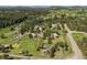 Aerial view of multiple houses surrounded by lush greenery and trees, showcasing a serene neighborhood at 713 Aspen Rd, Golden, CO 80401