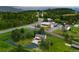 Aerial view showcasing the home's setting amidst lush greenery and a private driveway at 713 Aspen Rd, Golden, CO 80401