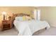 Bright bedroom with large bed, a wooden headboard, and a soft carpet at 713 Aspen Rd, Golden, CO 80401