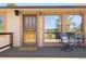 Inviting entryway with stylish door, 'welcome' mat and patio seating at 713 Aspen Rd, Golden, CO 80401