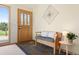 Foyer with slate tile, front door with sidelights, bench seating at 713 Aspen Rd, Golden, CO 80401