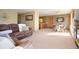 Open-concept living room with cozy seating and dining area at 713 Aspen Rd, Golden, CO 80401