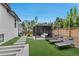 Inviting backyard with manicured lawn, a stylish gazebo, and comfortable lounge chairs for outdoor relaxation at 220 Glencoe St, Denver, CO 80220